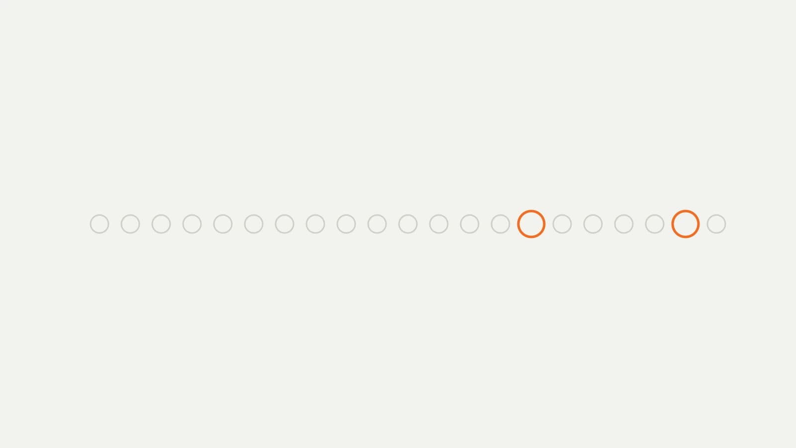 A wide stack of identical lead markers with only two picked out in orange at the far end.
